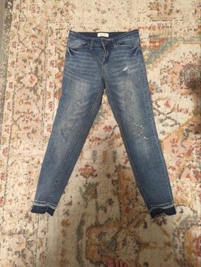 Women's Skinny Jeans in Mid Blue with Subtle Distressing